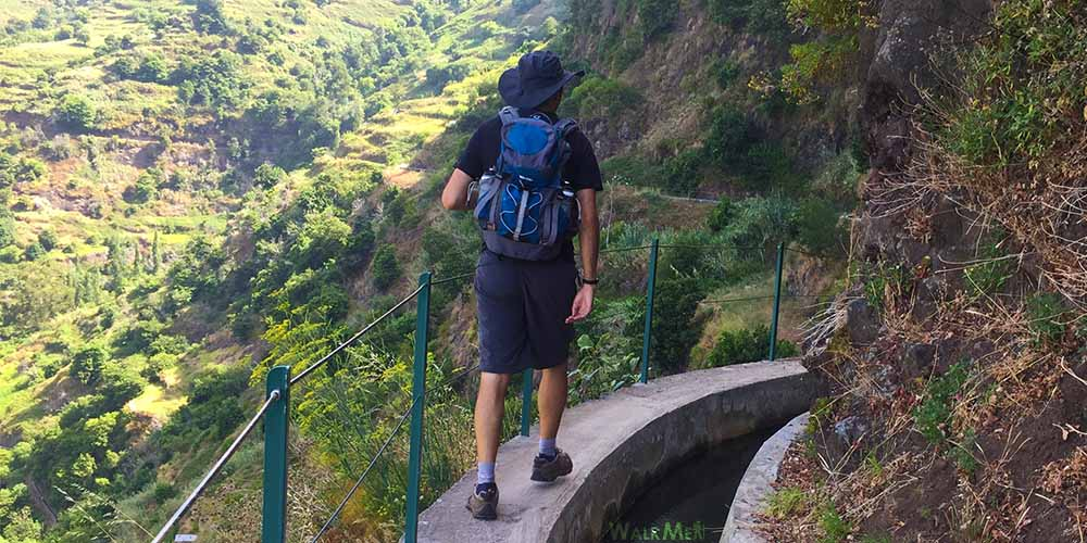 Hiker on levada trail with proper equipment